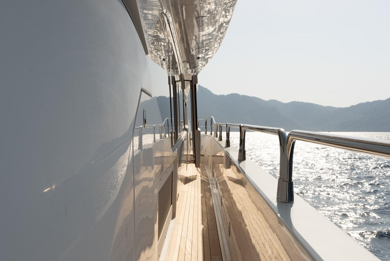 a wooden walkway on a snowy day aboard ROUND MIDNIGHT Yacht for Sale