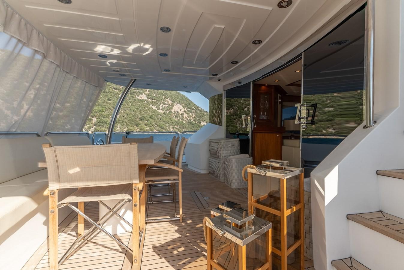 a room with chairs and tables aboard ROUND MIDNIGHT Yacht for Sale