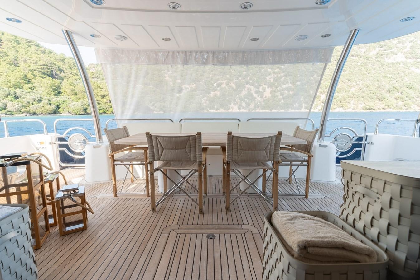 a room with a table and chairs aboard ROUND MIDNIGHT Yacht for Sale