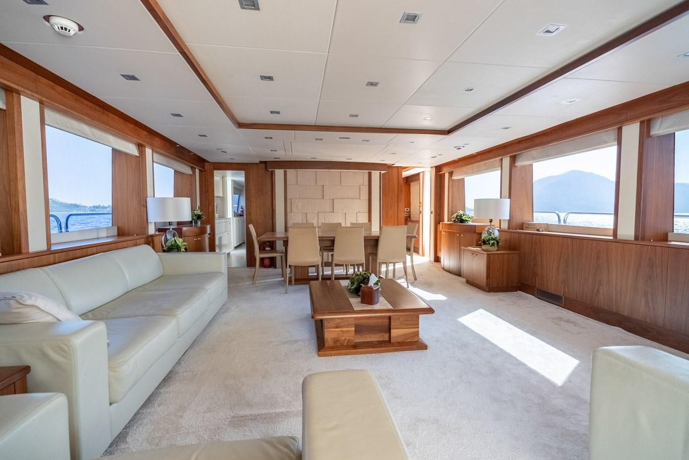 a living room with a couch and a coffee table aboard ROUND MIDNIGHT Yacht for Sale