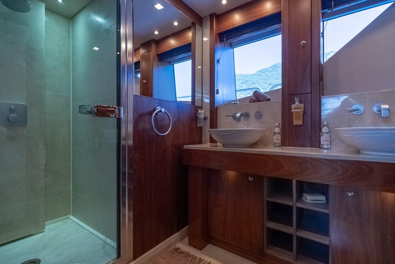 a bathroom with a sink and a mirror aboard ROUND MIDNIGHT Yacht for Sale