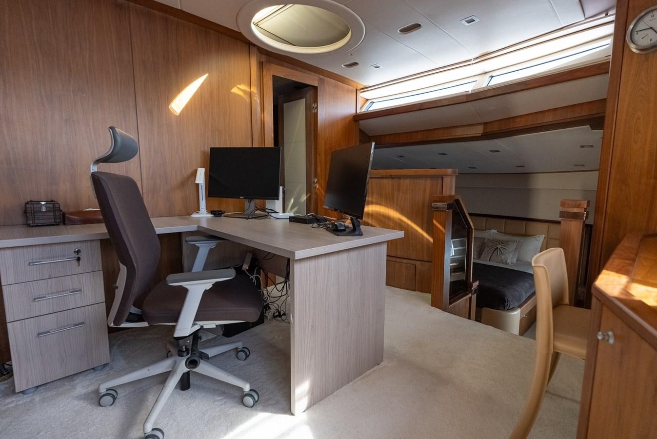 a room with a desk and a computer aboard ROUND MIDNIGHT Yacht for Sale