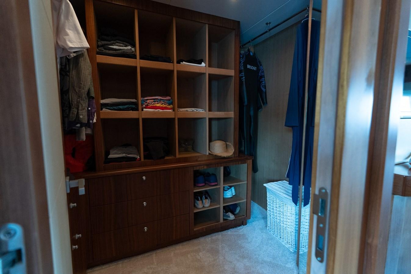 a closet with a shelf aboard ROUND MIDNIGHT Yacht for Sale