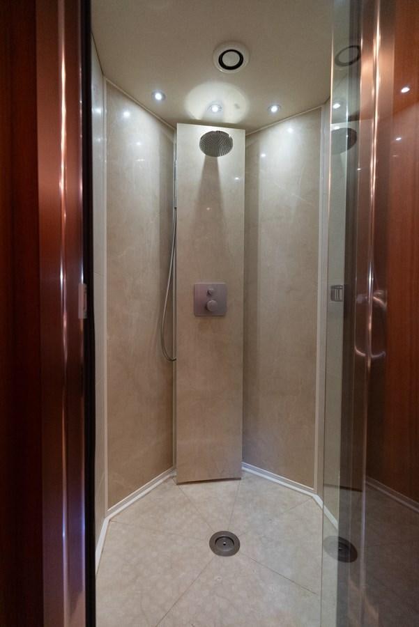 a bathroom with a shower aboard ROUND MIDNIGHT Yacht for Sale