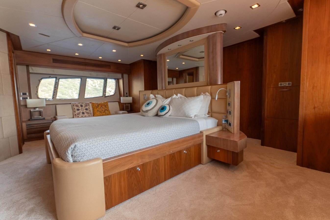 a bedroom with a large bed aboard ROUND MIDNIGHT Yacht for Sale
