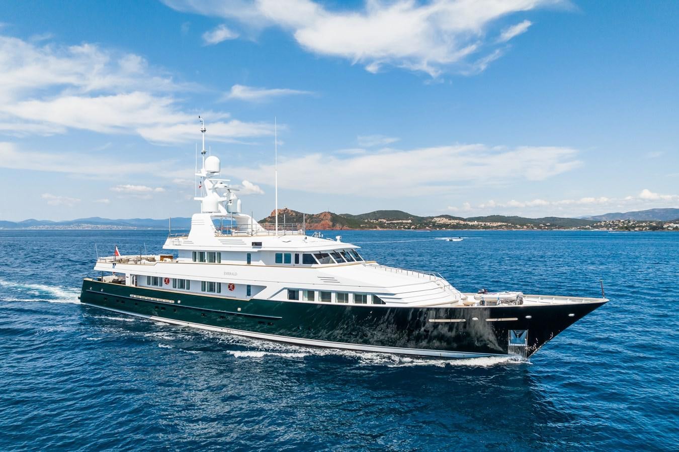 a large white boat in the water aboard EMERALD Yacht for Sale