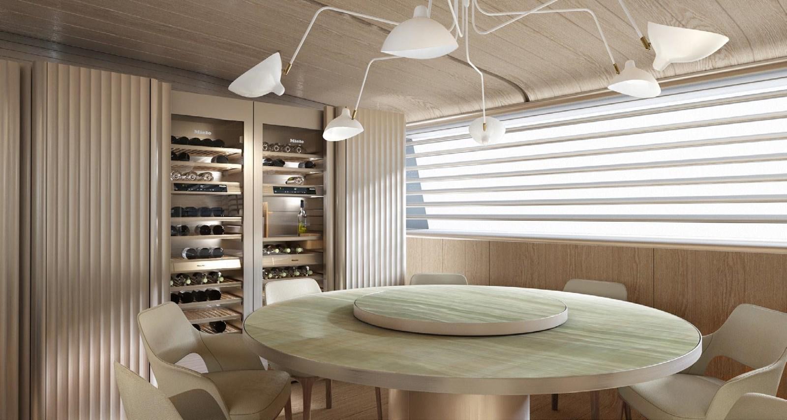 a room with a table and chairs aboard PERINI NAVI 47M SLOOP Yacht for Sale