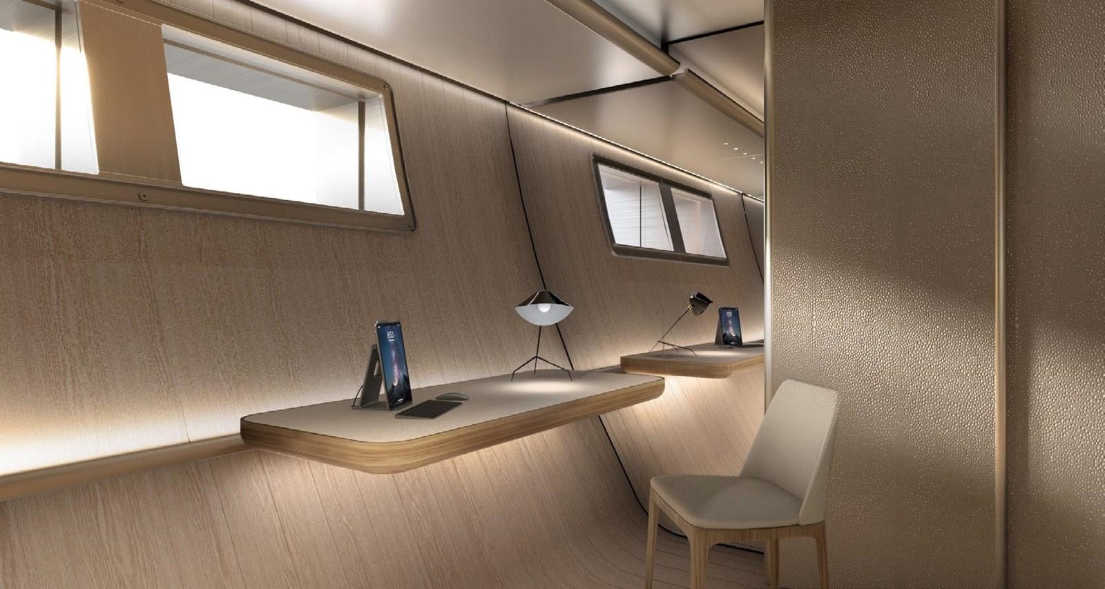 a room with a desk and a chair aboard PERINI NAVI 47M SLOOP Yacht for Sale