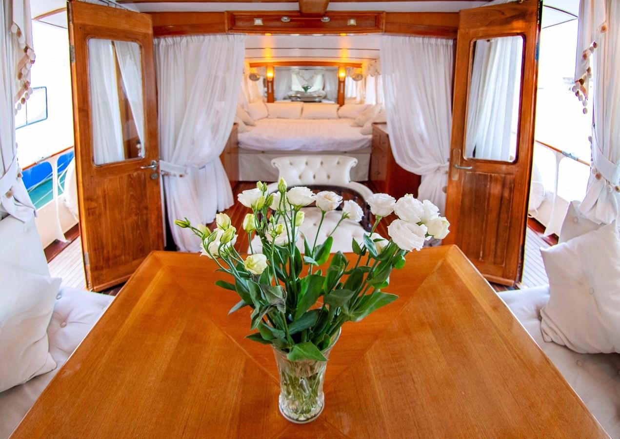 a vase of flowers on a table aboard FOREVER Yacht for Sale