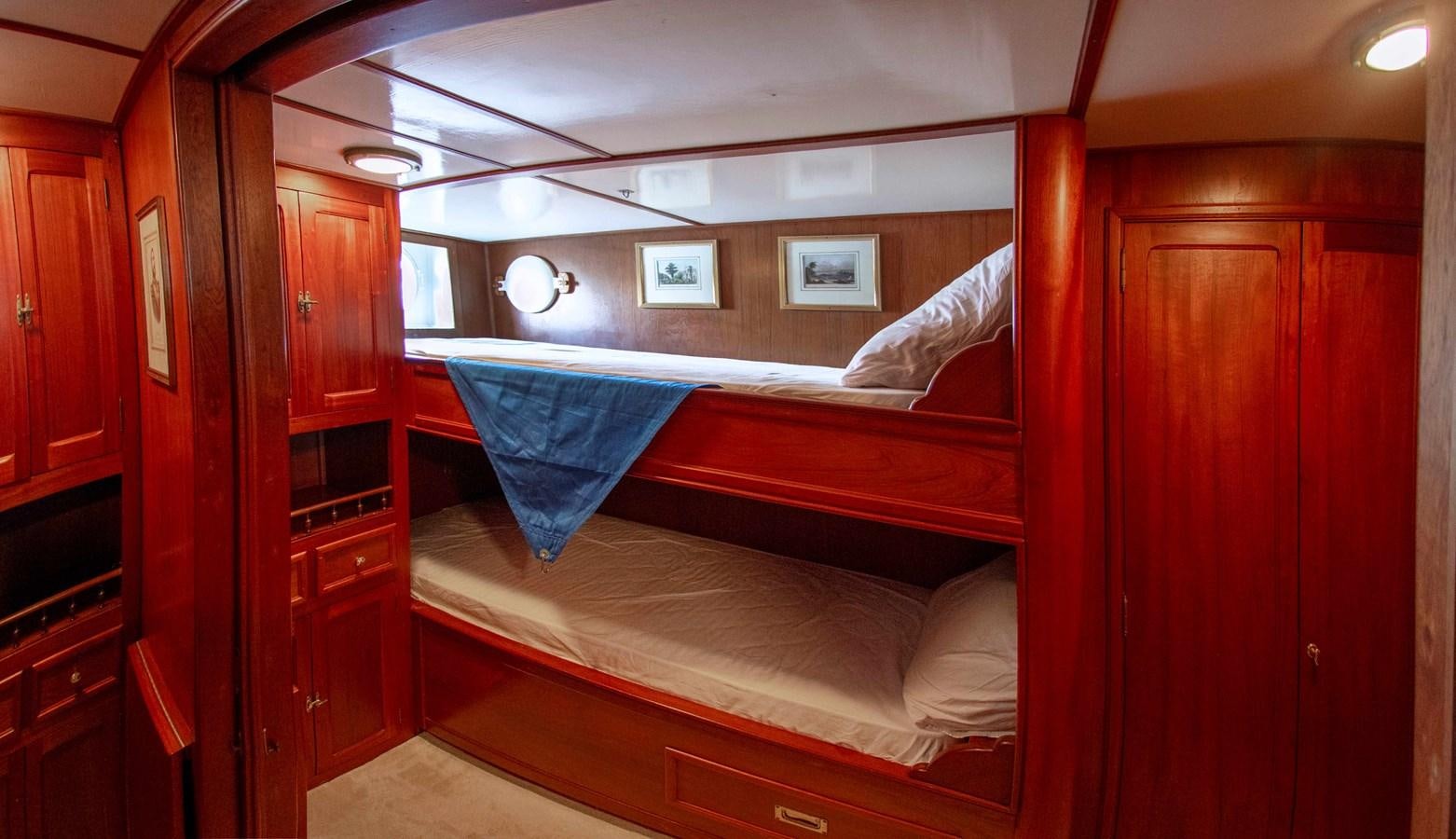 a bed in a room aboard FOREVER Yacht for Sale