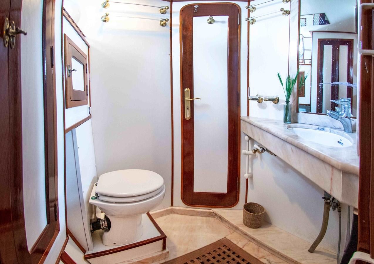 a bathroom with a toilet sink and a bathtub aboard FOREVER Yacht for Sale