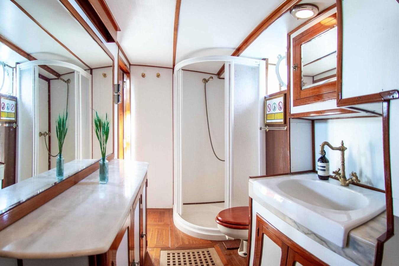 a bathroom with a urinal and sink aboard FOREVER Yacht for Sale