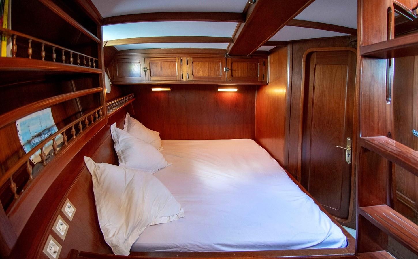 a bed in a room aboard FOREVER Yacht for Sale
