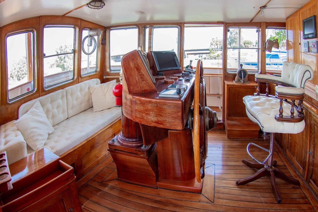 a living room with a piano aboard FOREVER Yacht for Sale