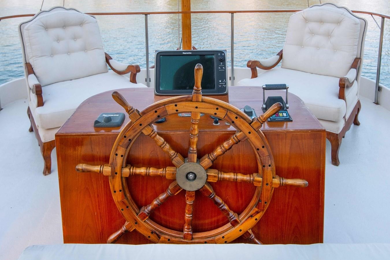 a wooden radio on a table aboard FOREVER Yacht for Sale