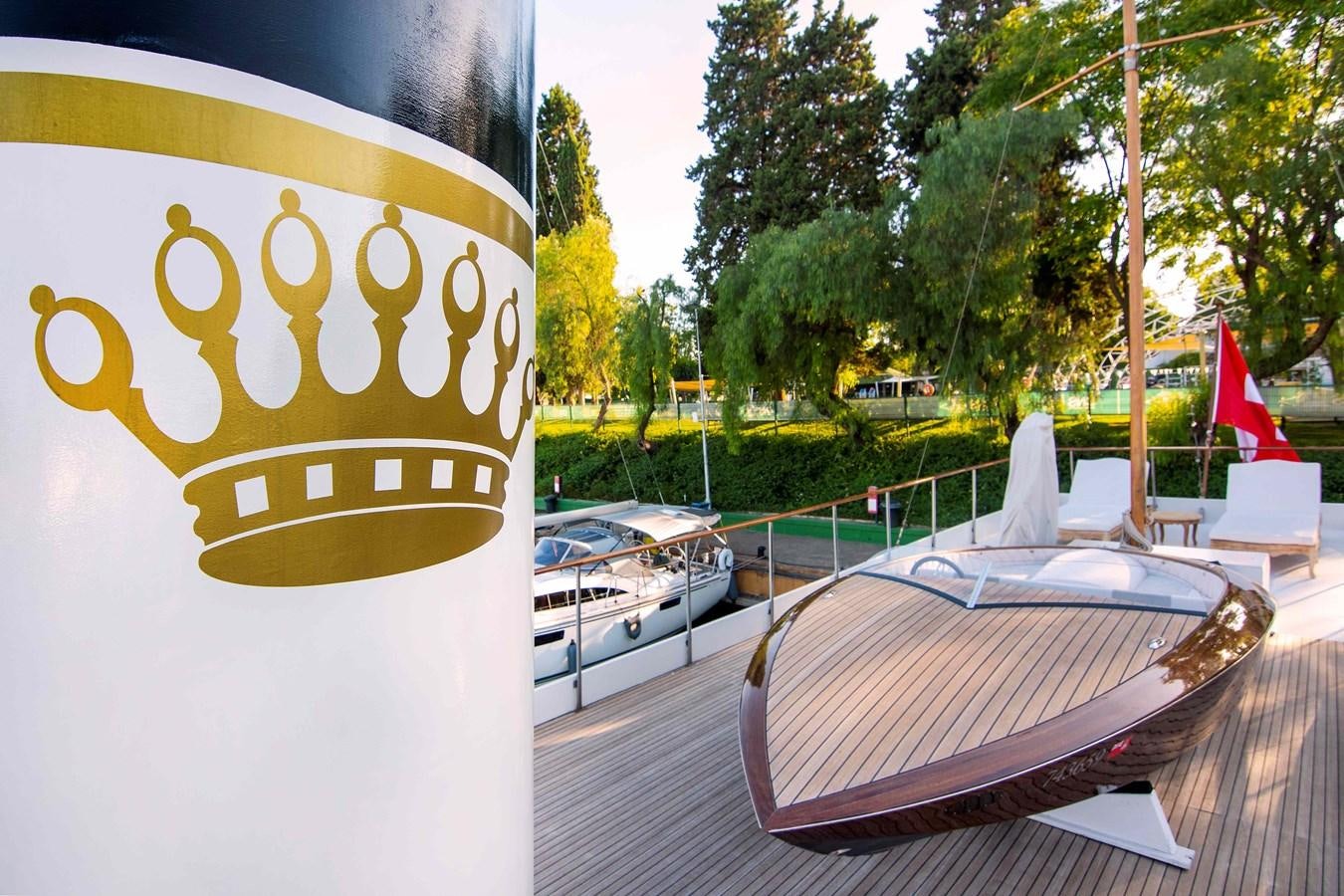 a yellow and white drink on a table outside aboard FOREVER Yacht for Sale