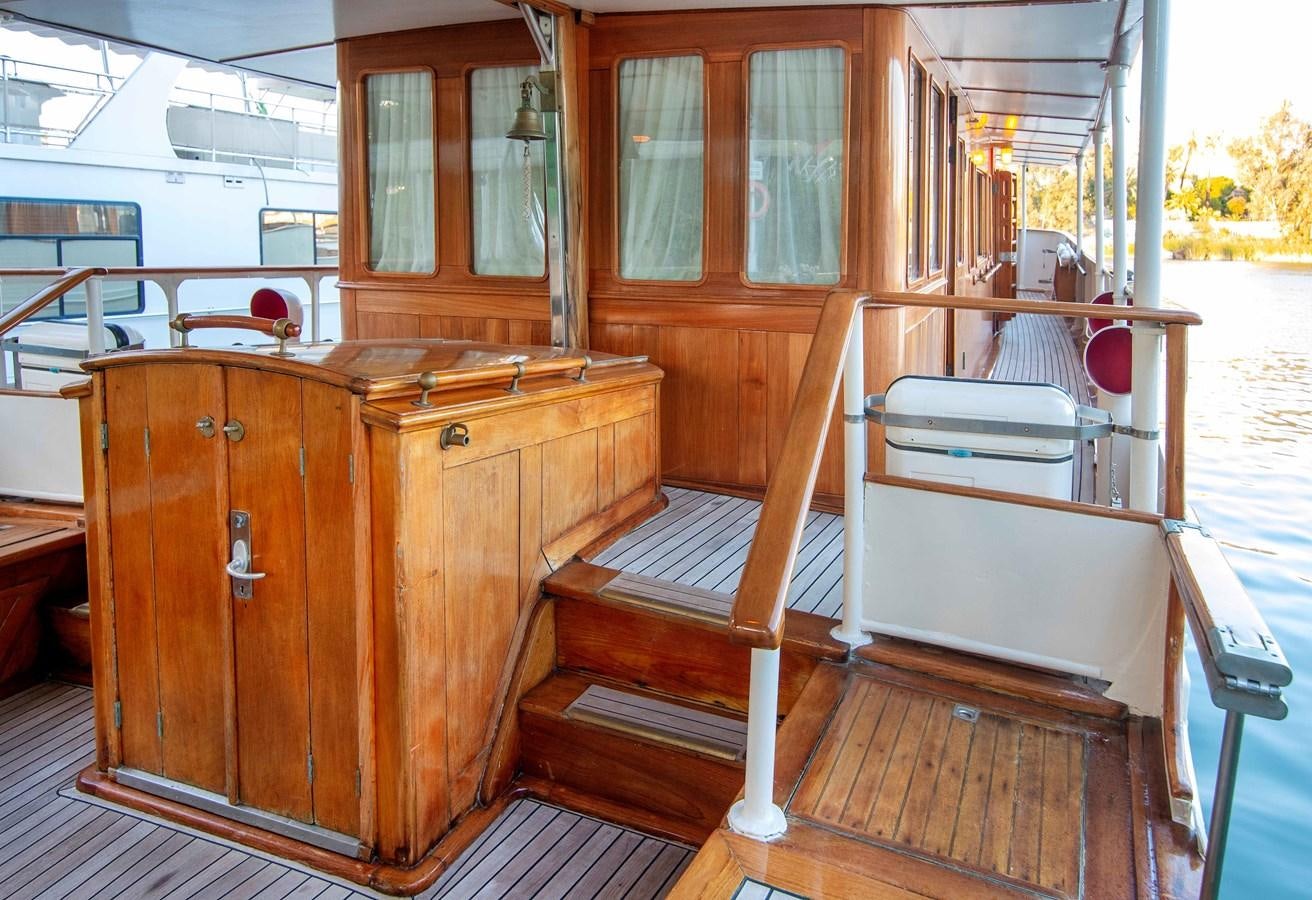 a wooden cabin with a bench aboard FOREVER Yacht for Sale