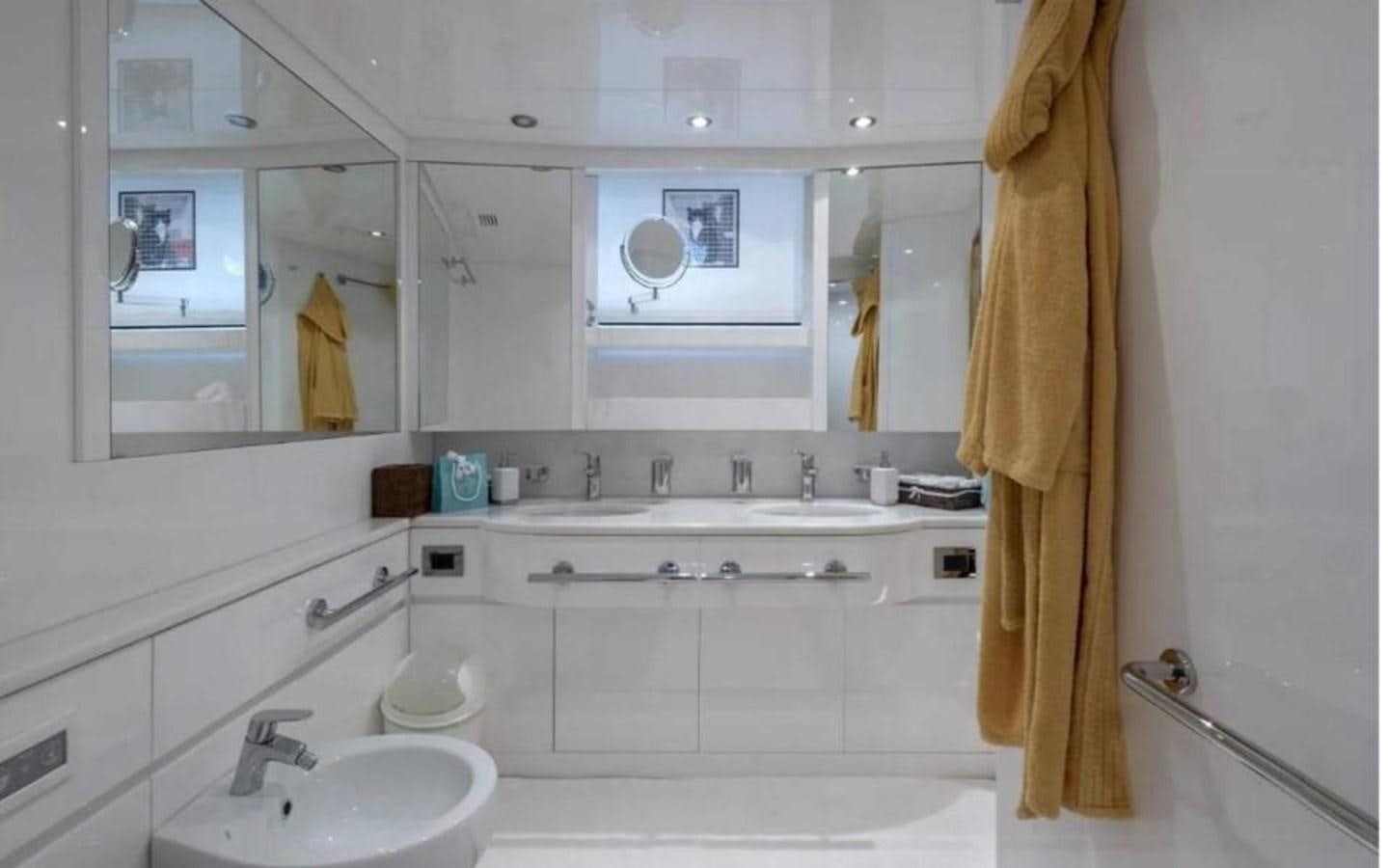 a bathroom with a sink and a mirror aboard FALCO Yacht for Sale
