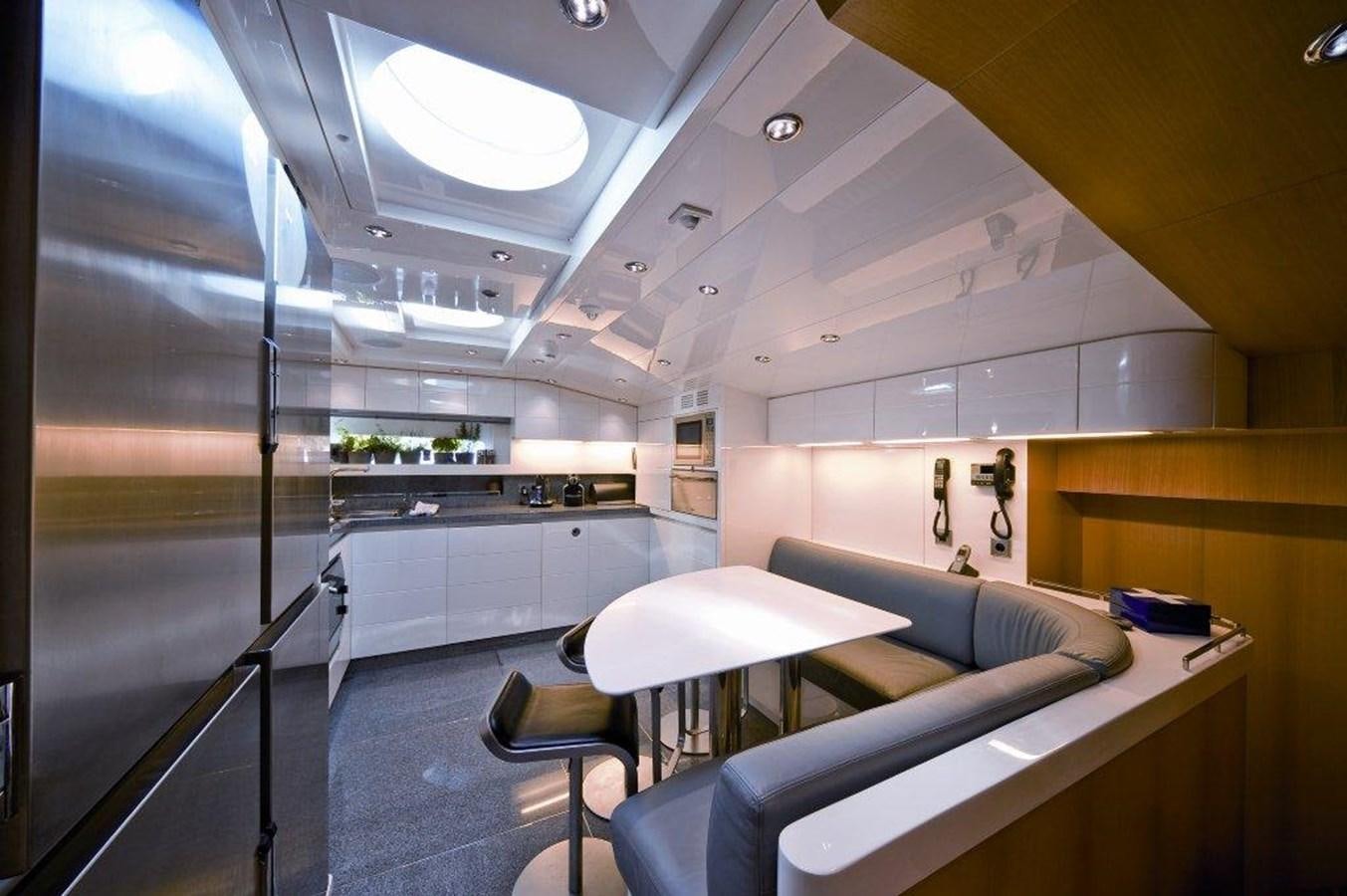 a kitchen with a glass wall aboard BALANDRAU Yacht for Sale