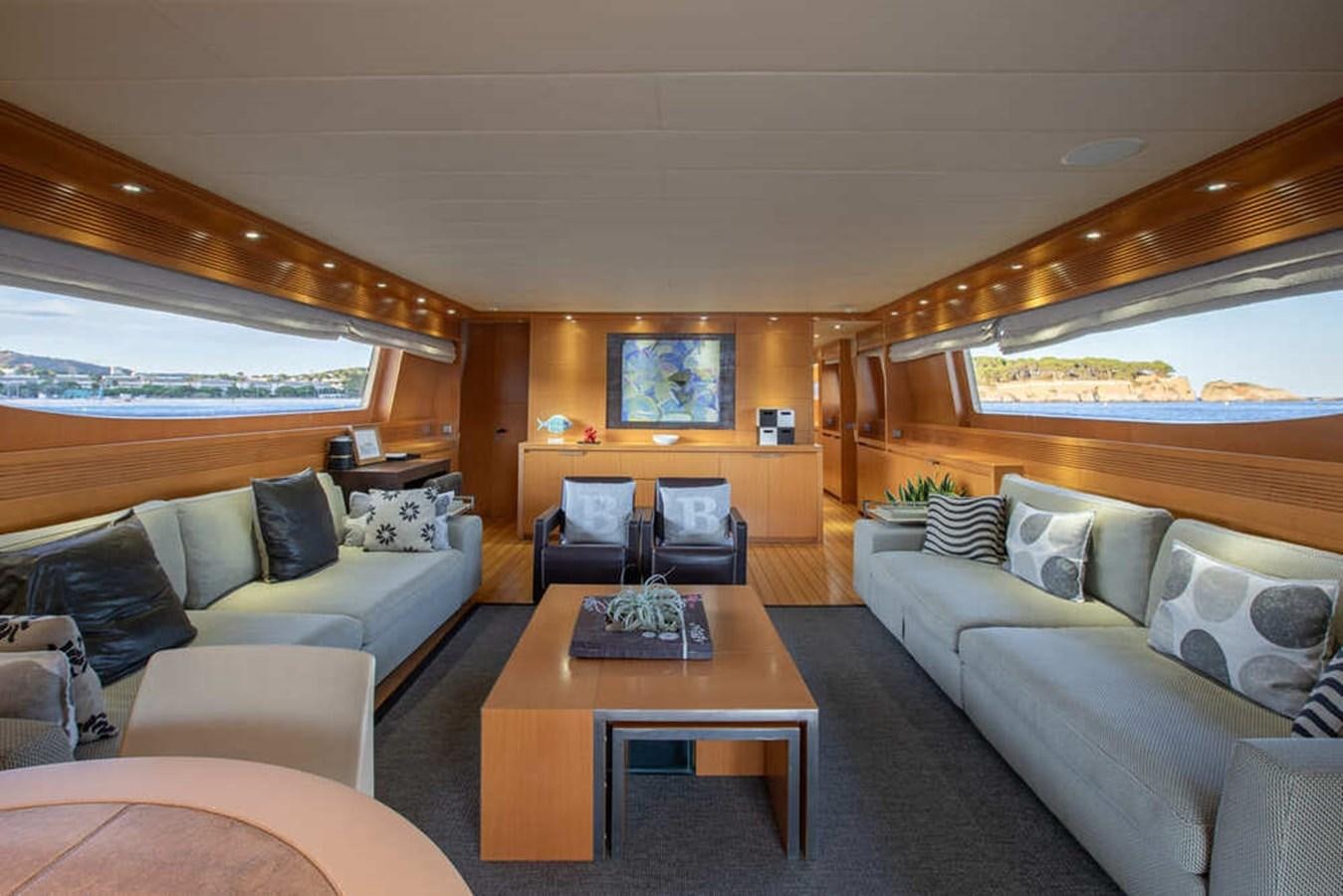 a living room with a couch and a coffee table aboard BALANDRAU Yacht for Sale