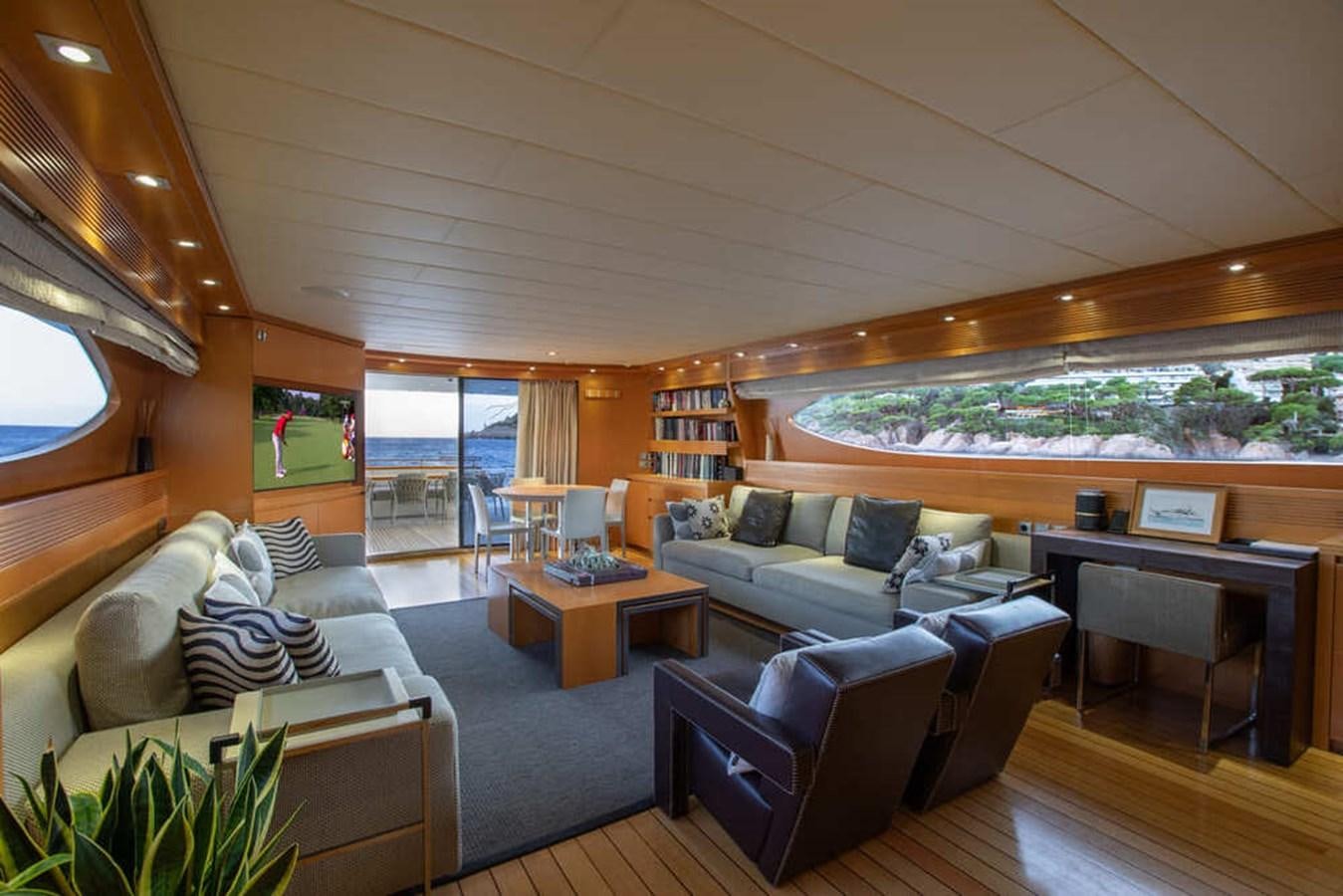 a living room with a large window aboard BALANDRAU Yacht for Sale