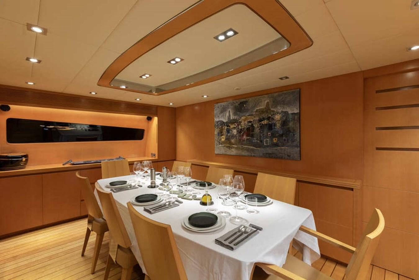 a dining room with a table aboard BALANDRAU Yacht for Sale