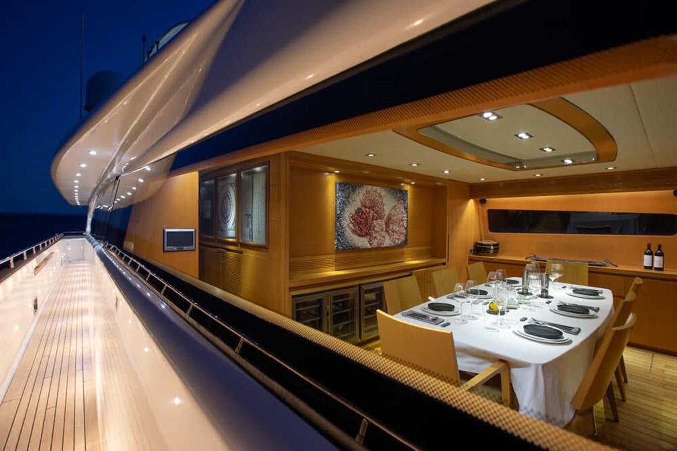 a dining table and chairs in a restaurant aboard BALANDRAU Yacht for Sale