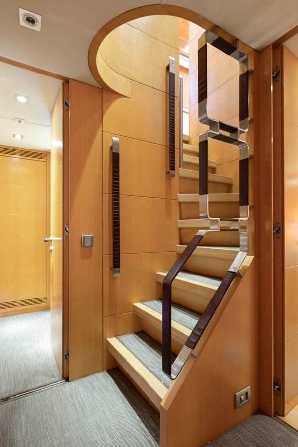 a wooden staircase in a room aboard BALANDRAU Yacht for Sale