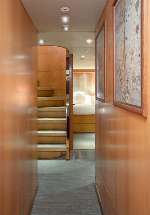 a hallway with wooden doors aboard BALANDRAU Yacht for Sale