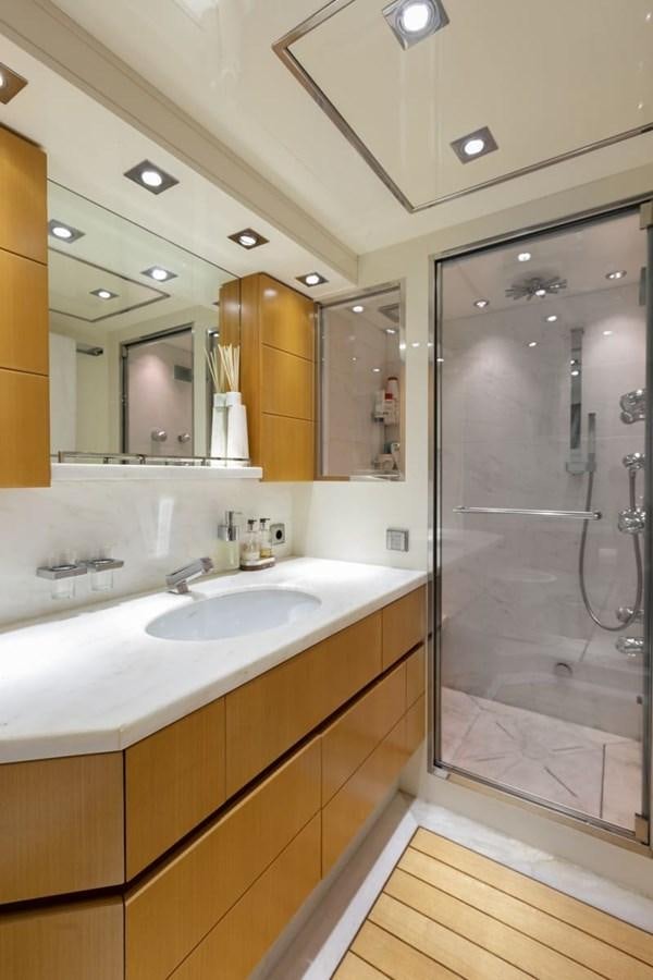 a bathroom with a glass shower aboard BALANDRAU Yacht for Sale