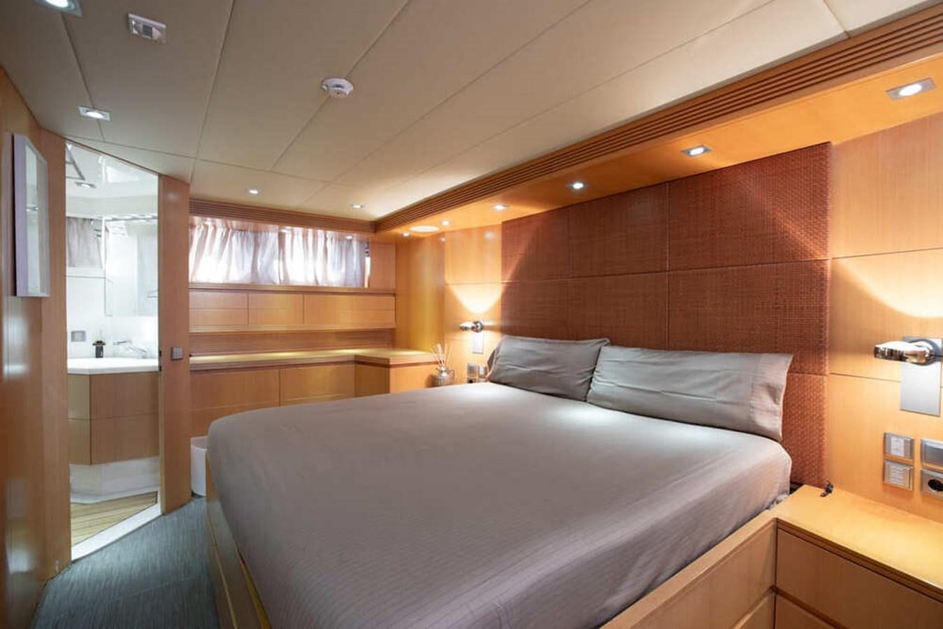 a room with a bed and a desk aboard BALANDRAU Yacht for Sale