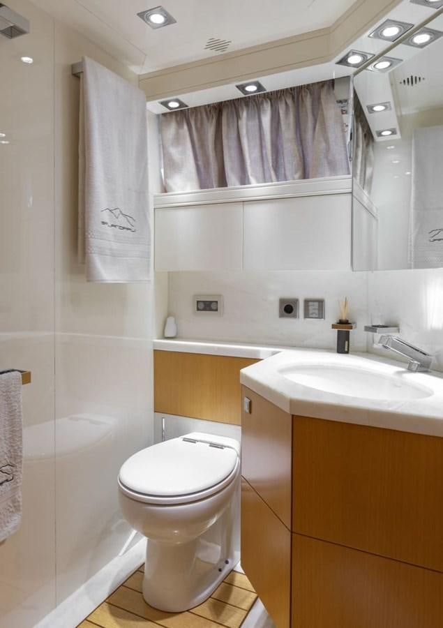 a bathroom with a toilet and sink aboard BALANDRAU Yacht for Sale