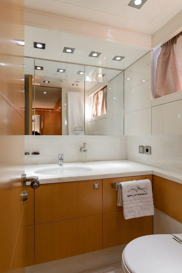 a bathroom with a large mirror aboard BALANDRAU Yacht for Sale
