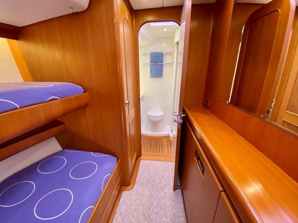 a bathroom with a tub and toilet aboard NIMROD Yacht for Sale