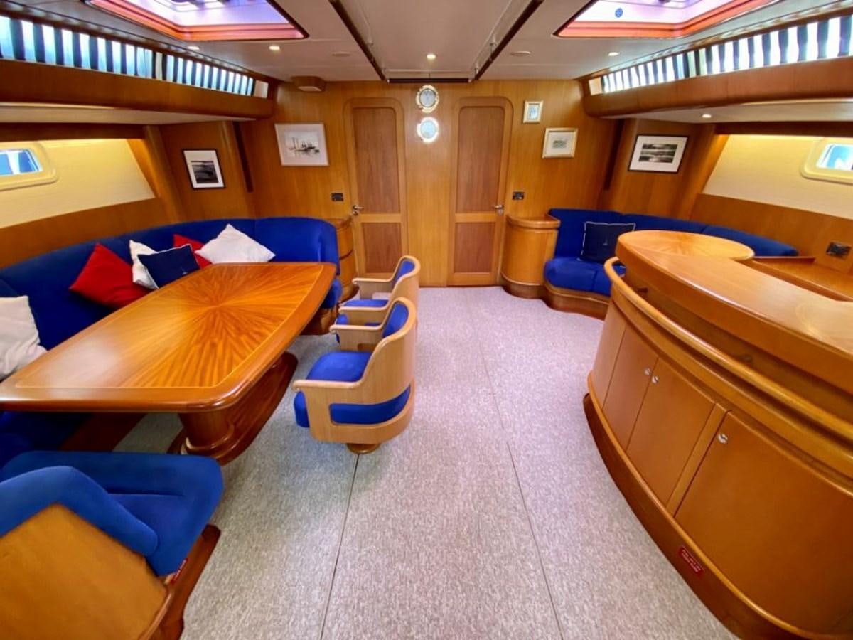 a room with beds and a desk aboard NIMROD Yacht for Sale
