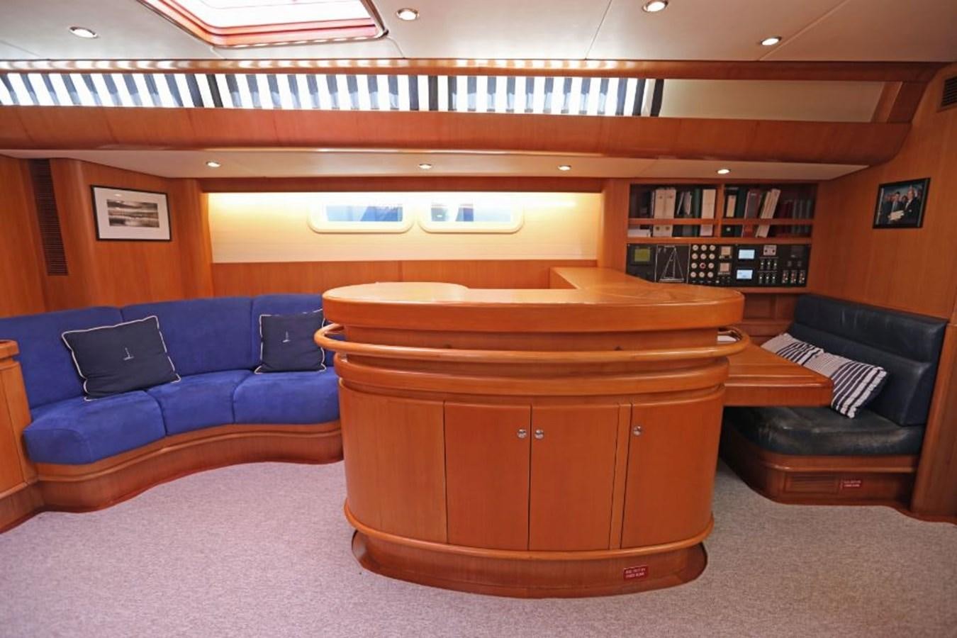 a room with a couch and a laptop aboard NIMROD Yacht for Sale