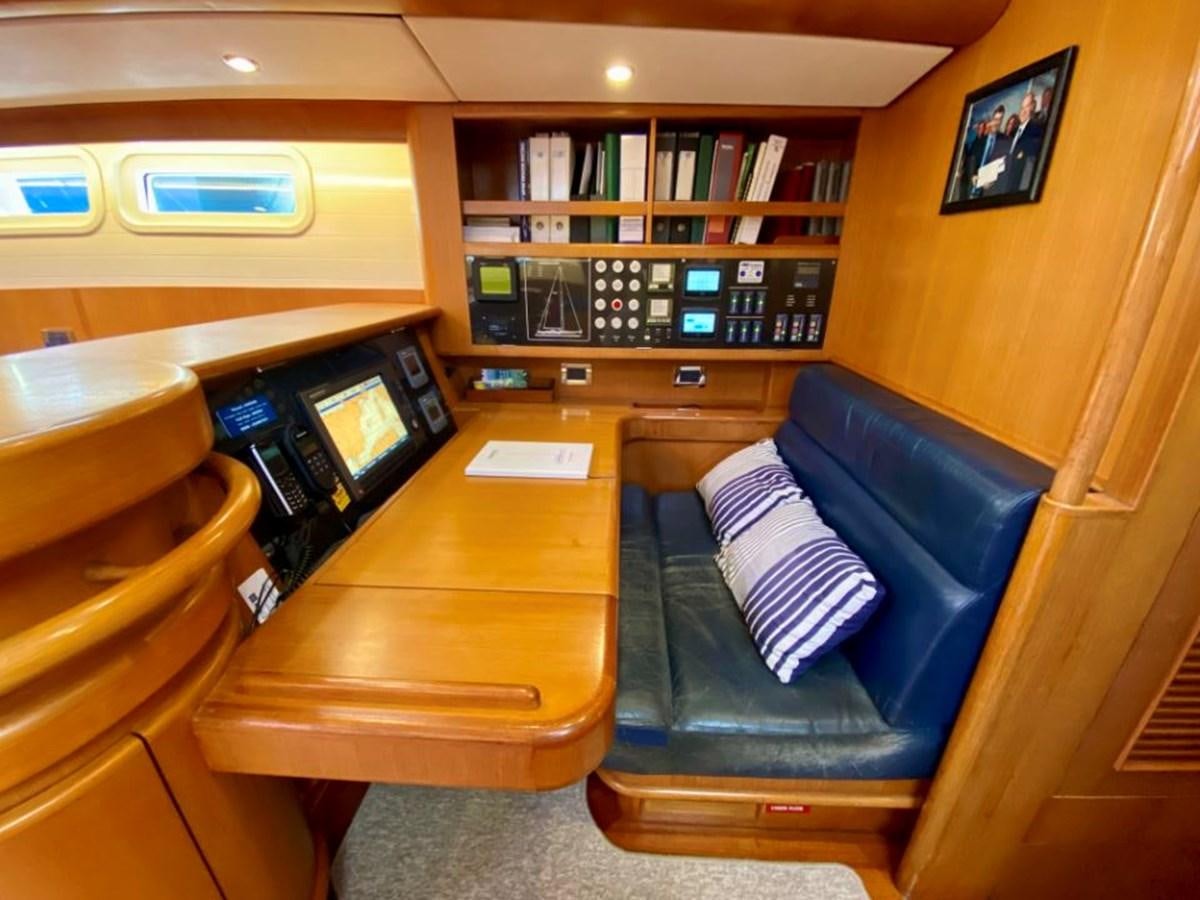 a room with a desk and a computer aboard NIMROD Yacht for Sale