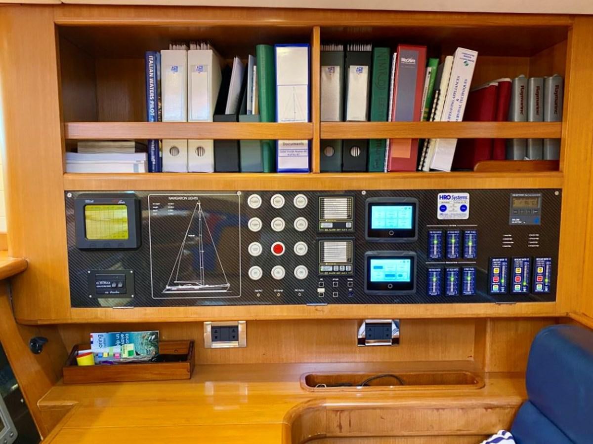a shelf with electronic devices aboard NIMROD Yacht for Sale