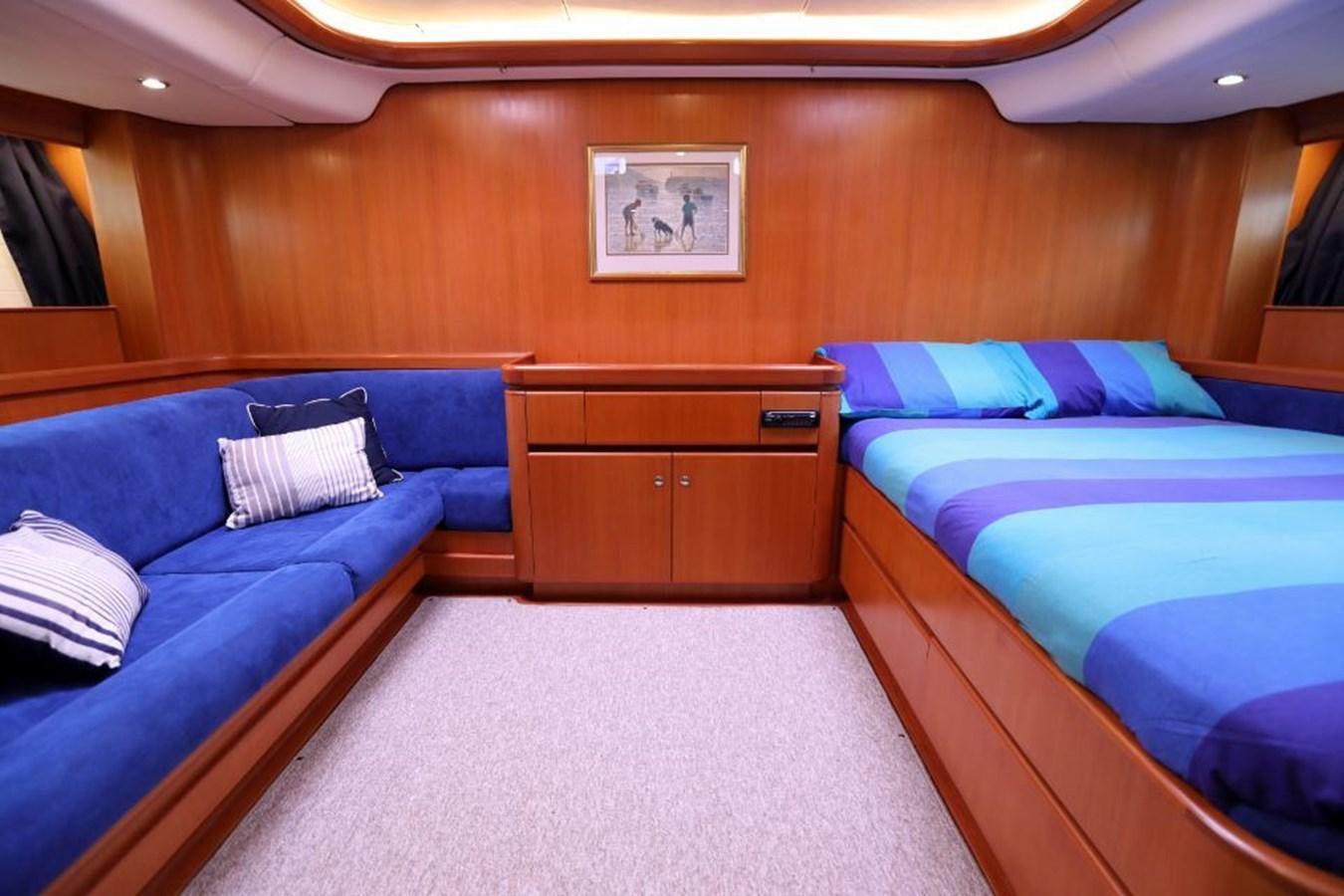 a room with a couple of beds aboard NIMROD Yacht for Sale