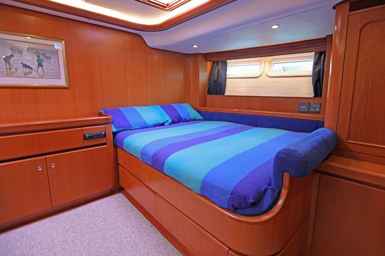 a bed in a room aboard NIMROD Yacht for Sale