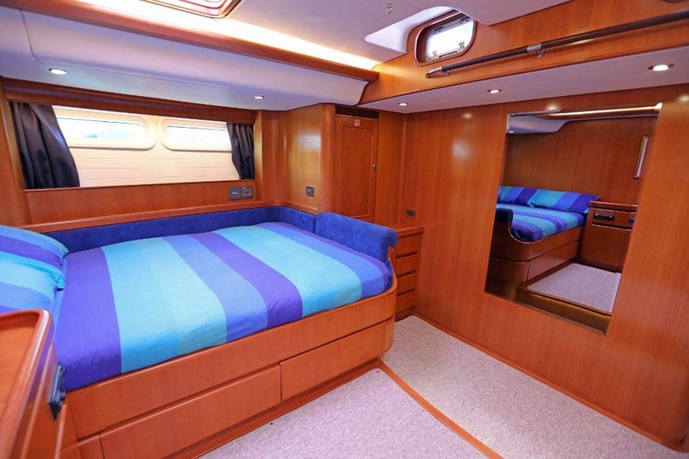 a cabin with a bed aboard NIMROD Yacht for Sale