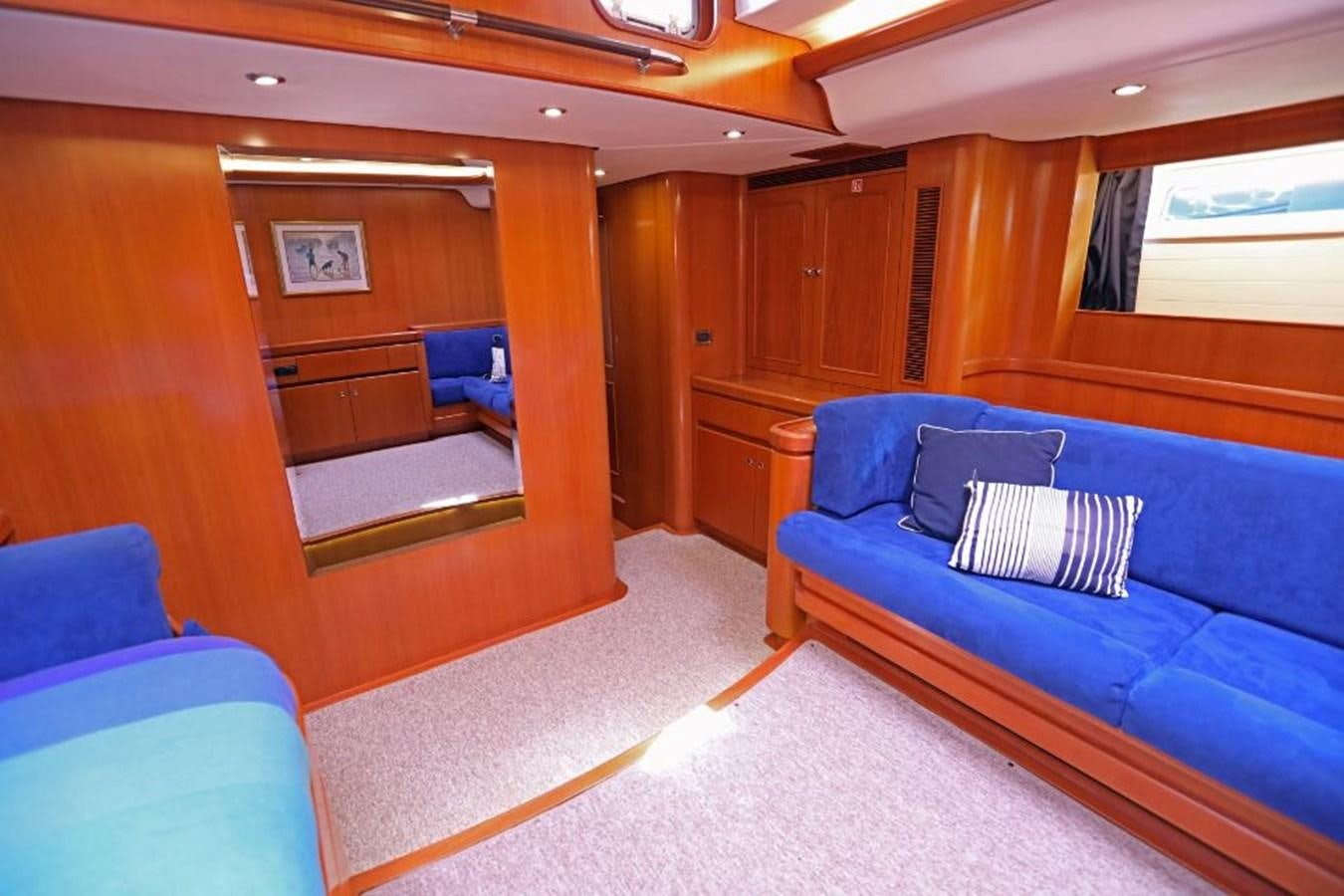 a room with a couch and a chair aboard NIMROD Yacht for Sale