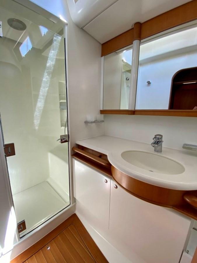 a bathroom with a sink and a shower aboard NIMROD Yacht for Sale