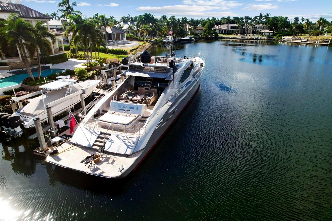 a boat docked at a pier aboard IZUMI Yacht for Sale