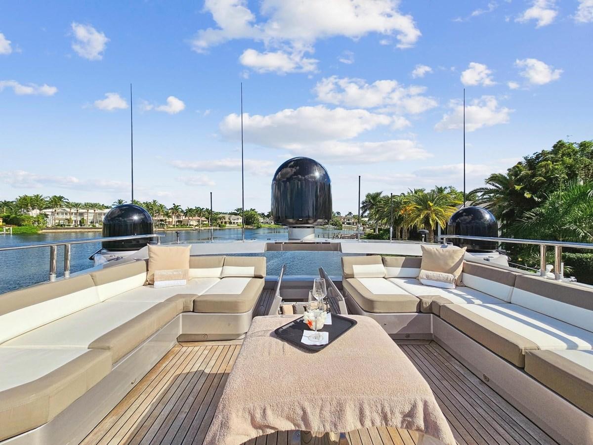 a deck with a table and a large black dome with a dome and a large black dome with aboard IZUMI Yacht for Sale