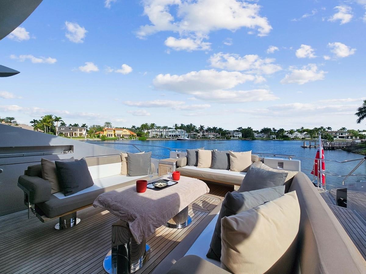 a deck with a view of a city and water aboard IZUMI Yacht for Sale