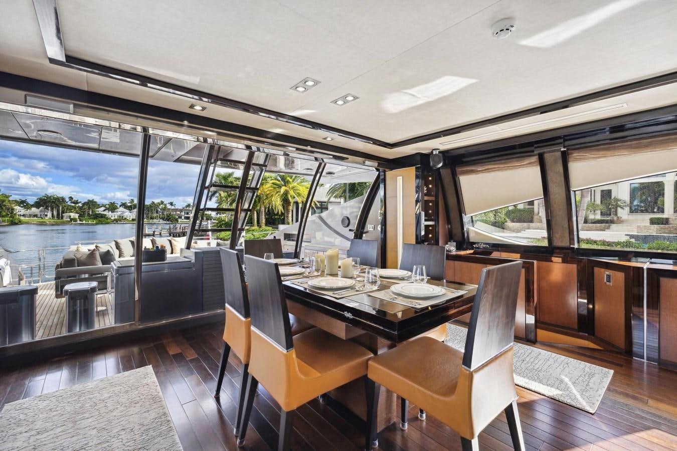 a dining table in a room aboard IZUMI Yacht for Sale