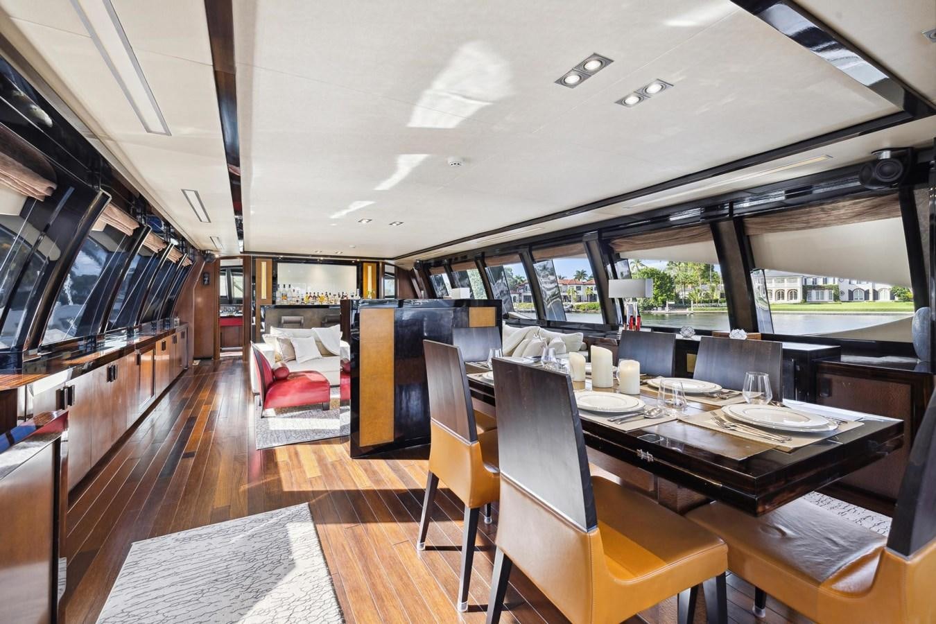 a room with a table chairs and a large window aboard IZUMI Yacht for Sale