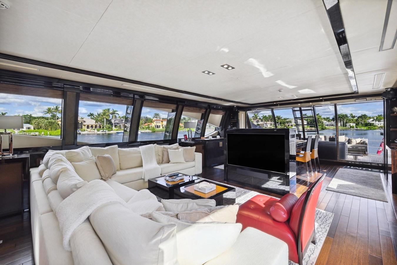 a living room with a large window aboard IZUMI Yacht for Sale