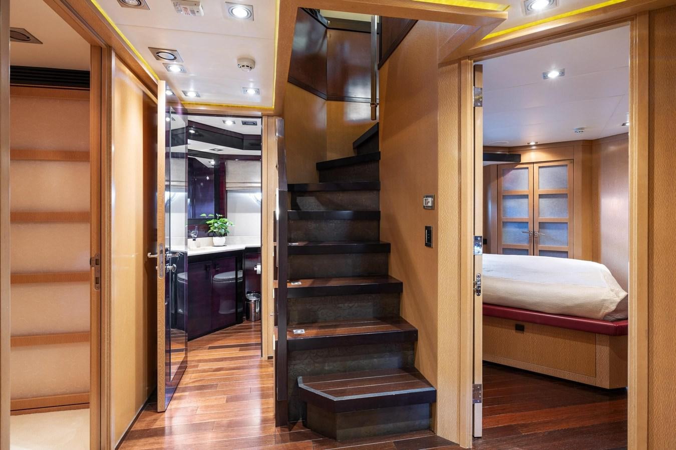 a room with a bed and a closet aboard IZUMI Yacht for Sale